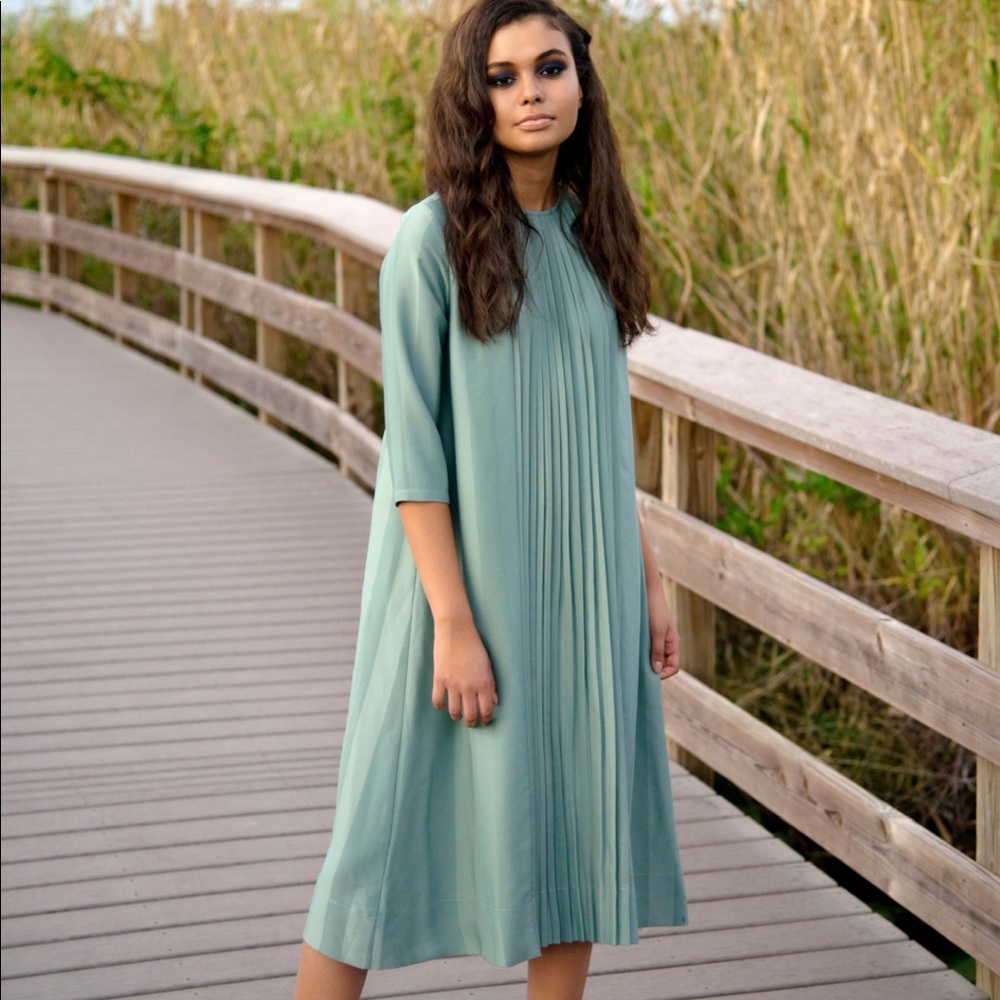 Selling this green midi dress. Brand new with tags